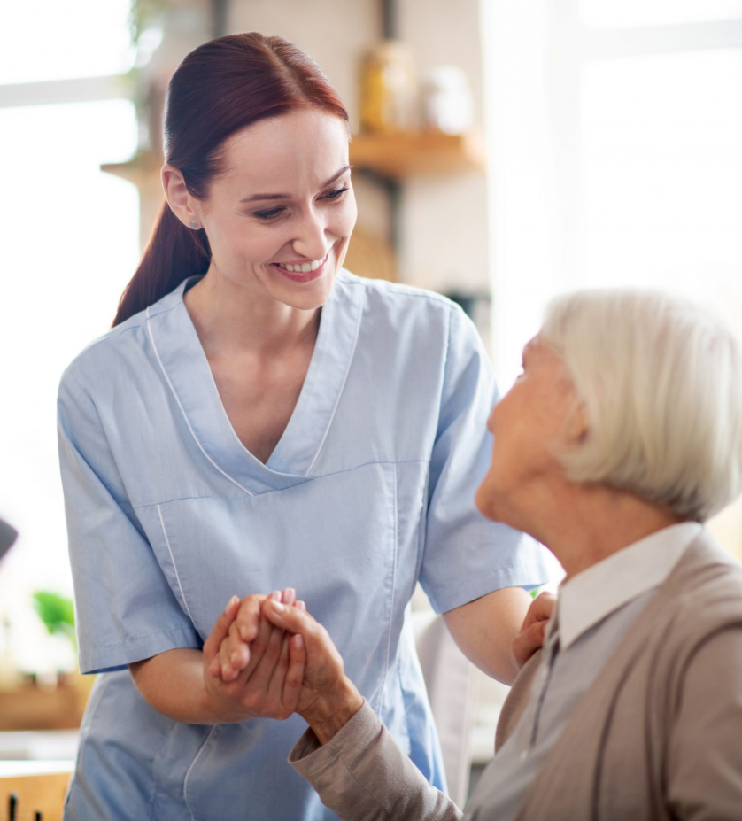 A caregiver assisting a senior with daily living activities at home